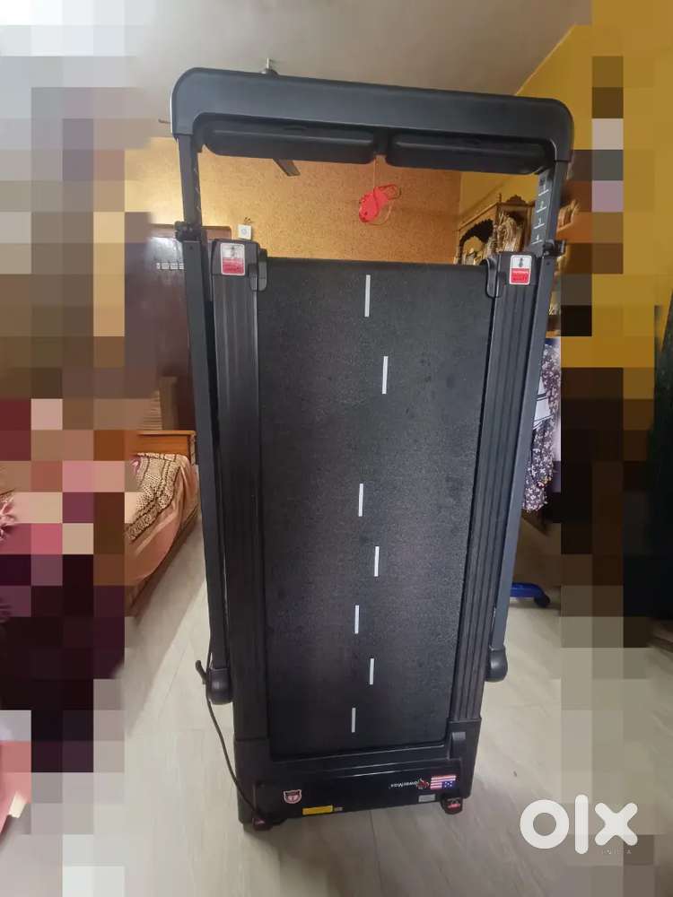 Foldable Powermax treadmill with desk attachment