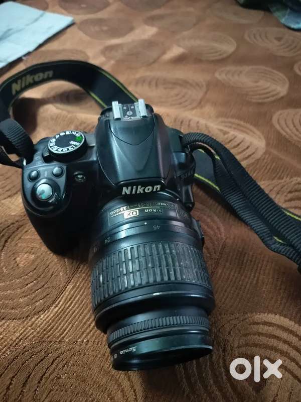 Nikon DSLR camera model D3100 with charger