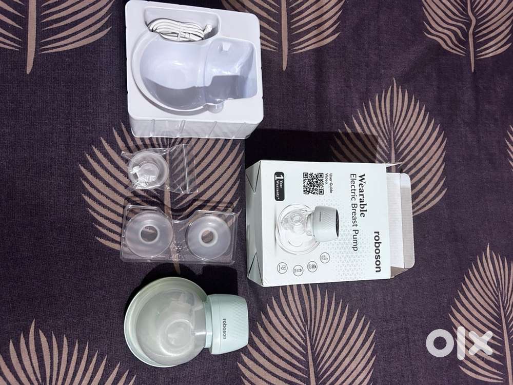 Wearable electric breast pump