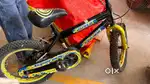 16T cycle suitable for 3 to 7 yrs kid in black and green colour