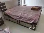 wooden cot and mattress
