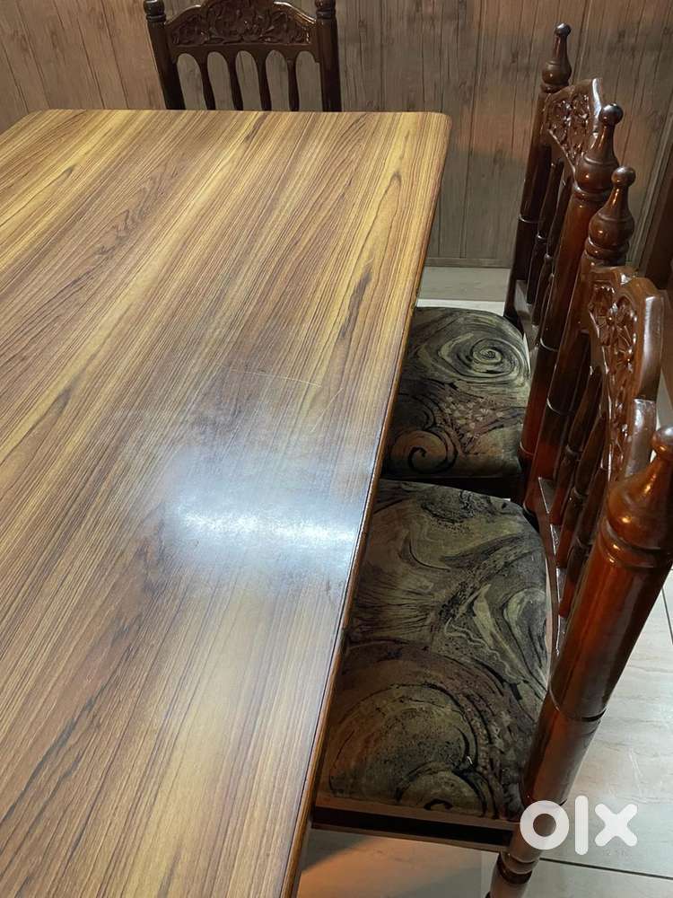 Wooden dining table with six chairs