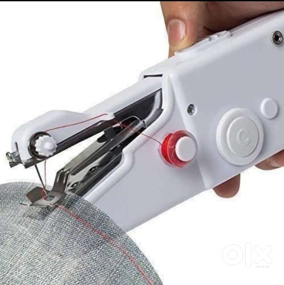Portable White Sewing Machine

- Nerul