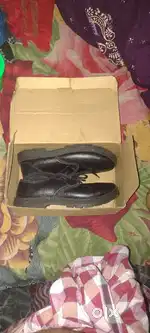 Im selling my school black shoe brand new box packing