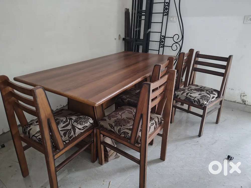 6 seater dining table for sale made of wood.