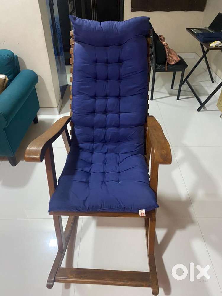 Wooden rocking chair with cushion