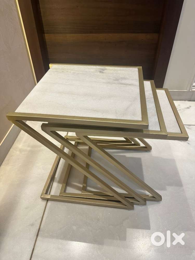 Set of Three Nesting Tables of Metallic Base and White Marble Top.