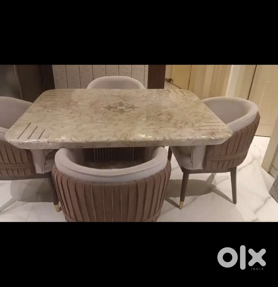 4 seater dining table with marble top and 4 cushioned chairs