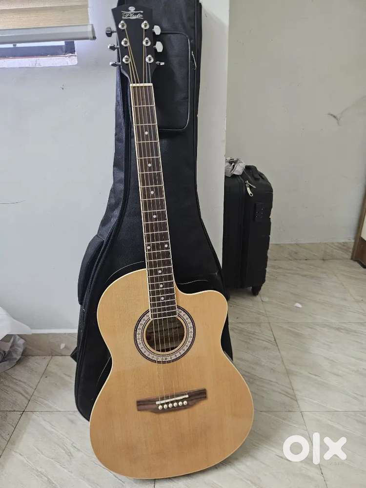 Pluto Acoustic Guitar – Brand New Condition  Bought ₹6,500  Not Used