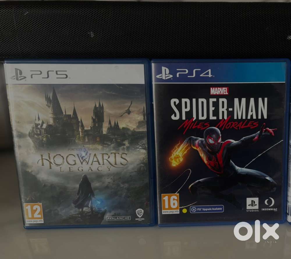 Hogwarts Leagcy and Miles Morales game discs
