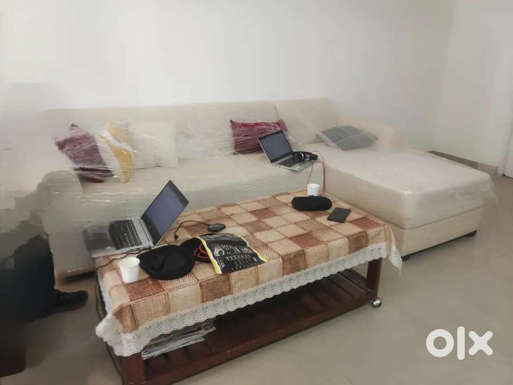 L shape sofa  - almost new condition (table not included )