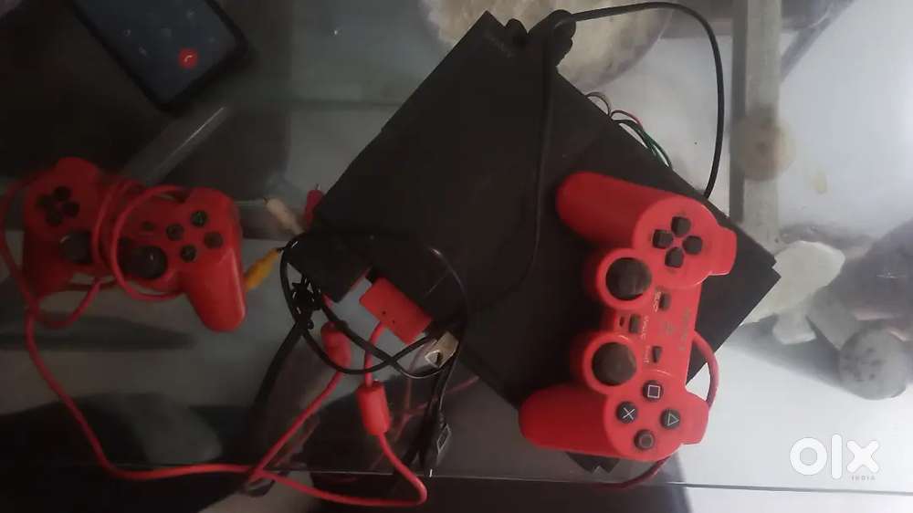 Sony play station 2 with two remote  consol memory card origina