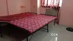 Folding iron cot bed with attached foam and cover colour