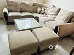 5 seater sofa with 2 muffins and center table
