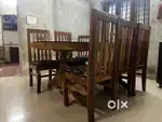 6 seater Glass top wooden dining table and chairs