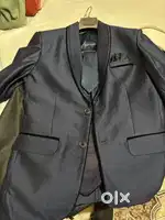blue colored blazer vest tie pant