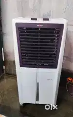 A brand new air cooler with 55 liters capacity blower technology