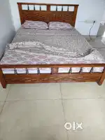 Wooden double bed without mattress