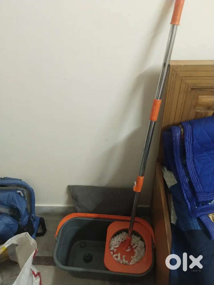 Mop with stand attached tub
