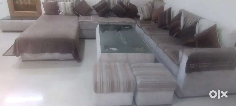 8 seater sofa with table and 2 side puffy and 1 side table