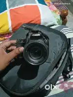 Canon 200d  dslr with 55mm and 250mm lenses  4 years
