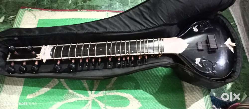 Sitar is available for sale with bag mizrab