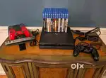 Sony Playstation PS4 Slim 1 TB Console W/7Games & 2Controllers Used