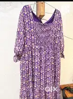 Purple Flowy, boho-chic midi dress featuring a vibrant purple print