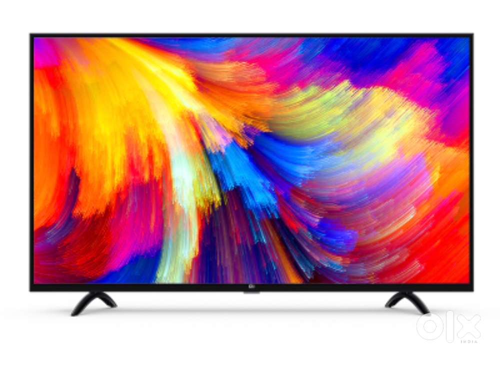 Selling my 32” Mi Smart TV along with TV table