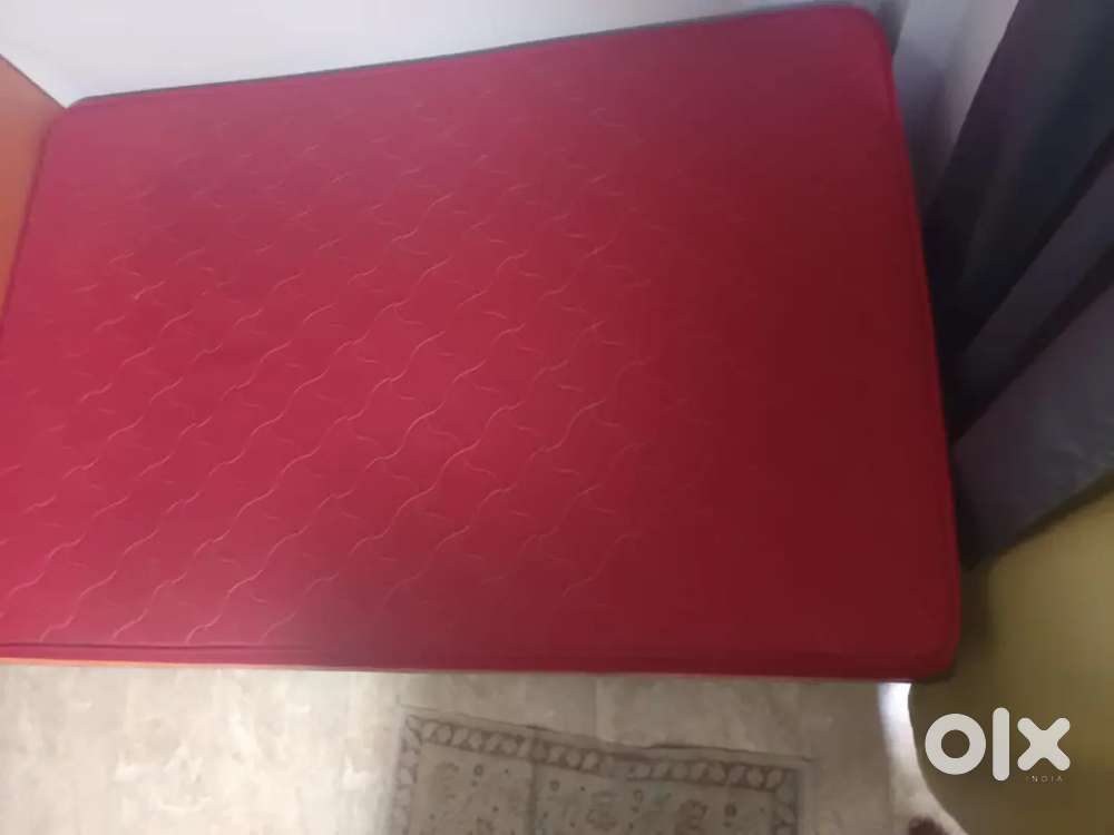 Hardwood bed with a mattress for sale at an unbelievable price.