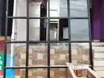 Shop doors glass and columns work name board