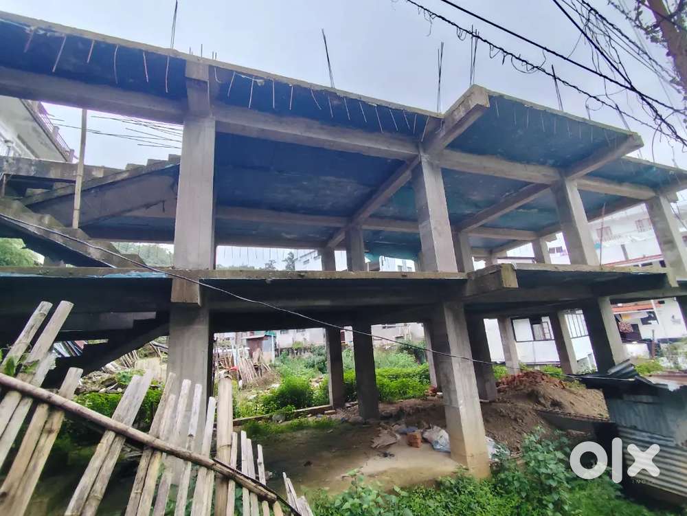 Land with unfinished building
