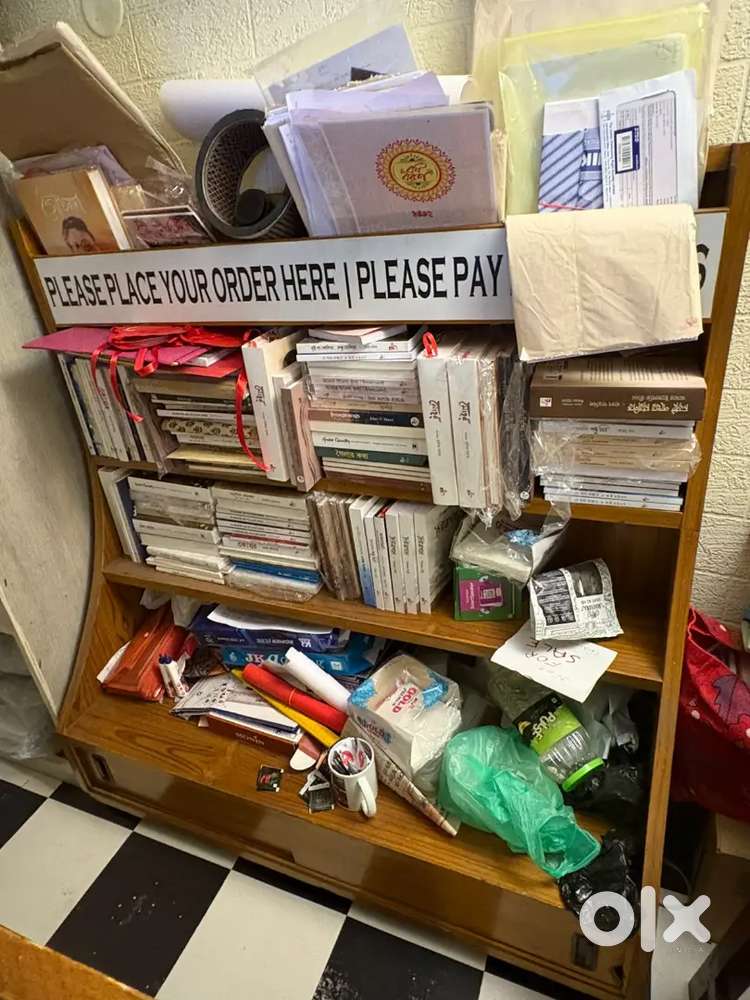 Book self and wooden rake