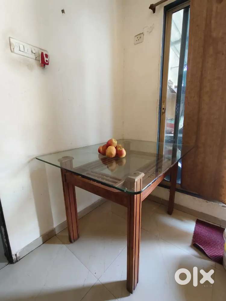 Glass Top Dining Table with 4 Solid Wooden Chairs.