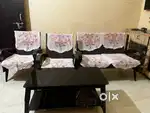 Vintage-Chic Wooden Sofa Set with Glass-Top Table   Timeless elegance