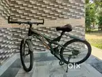 Gear cycle with helmet