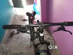 red and black colour stunt modification and hydraulic disc brakes