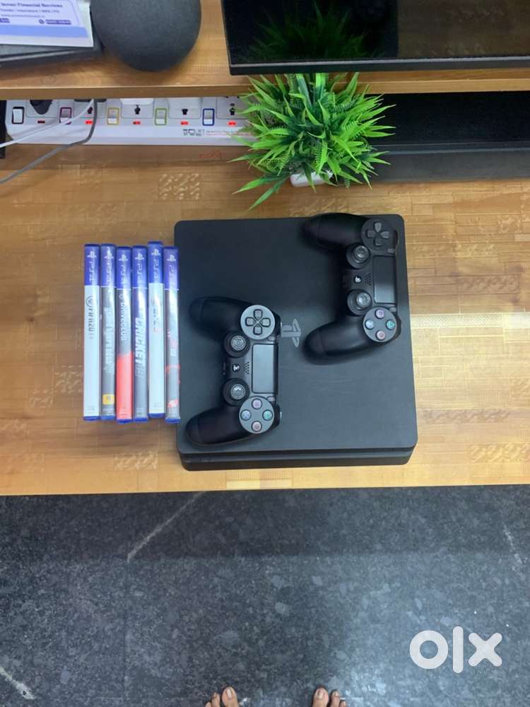 PS4 Slim 1TB + 2 Original Controllers + 6 Games (Excellent Condition)