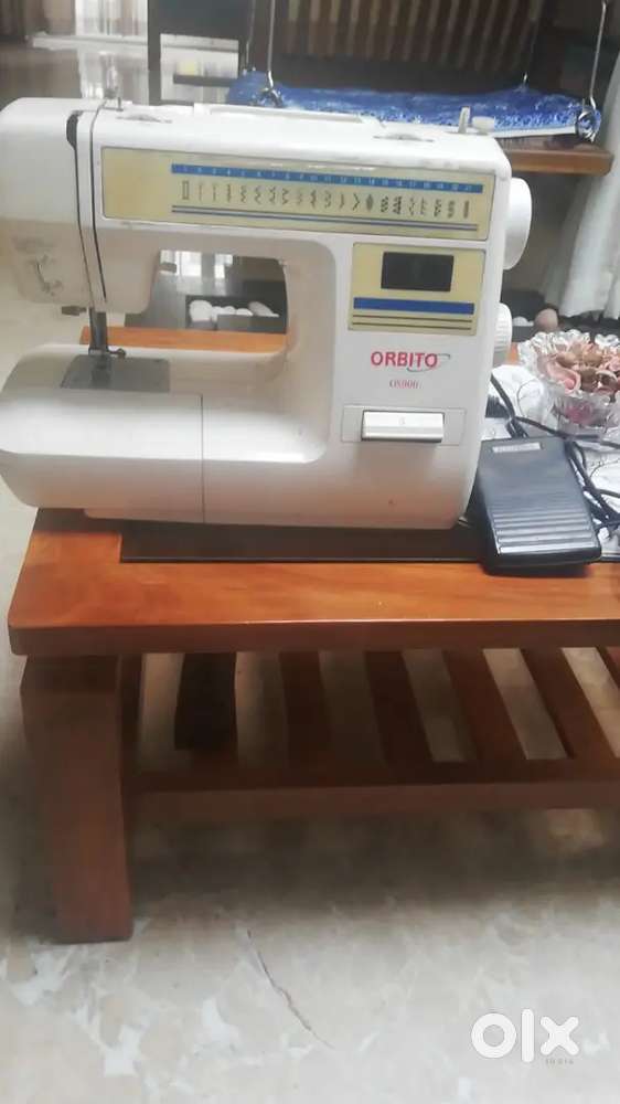 Electric sewing machine/umbrella