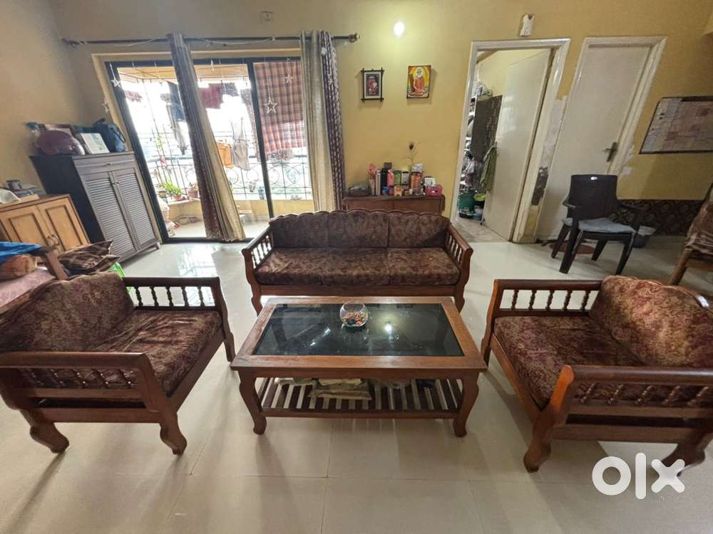 Teak wood Sofa set - one 3 seater, 2 one seater and 1 center table.