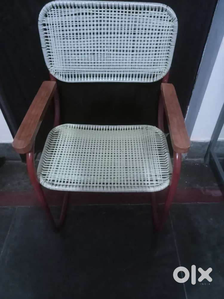 Study chair of iron with wooden handle