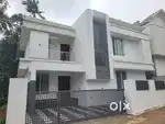 AN AMAZING NEW 4BED ROOM 2200SQ FT 5CENT VILLA IN KURIACHIRA,THRISSUR
