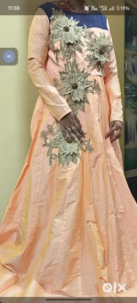 This appears to be a peach-colored gown or Anarkali dress with floral