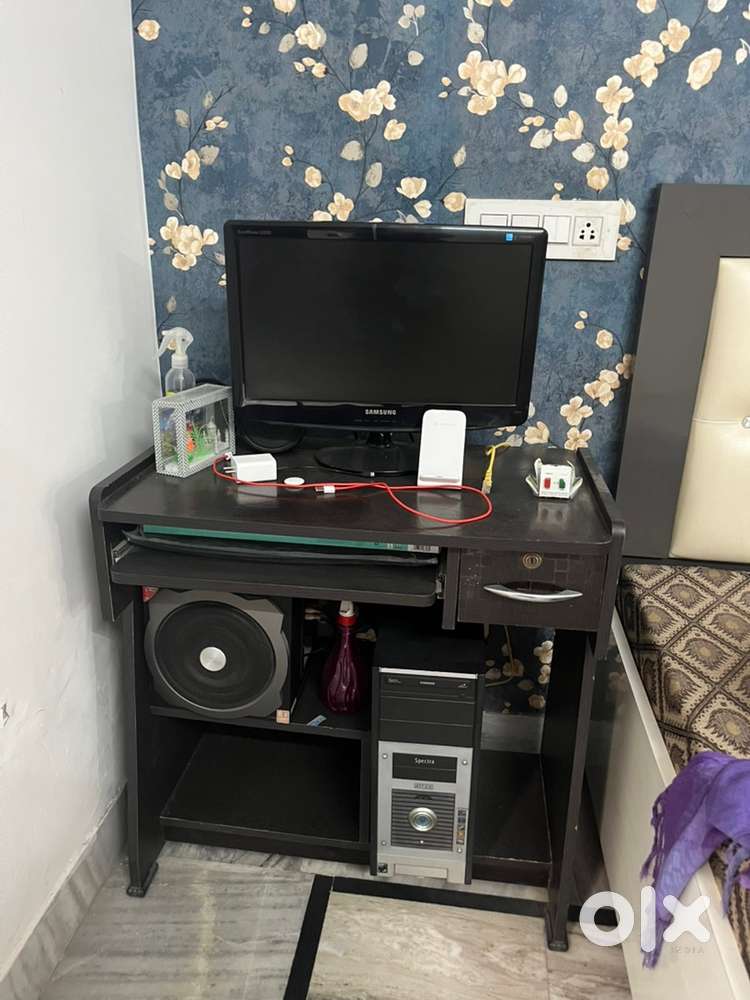 Computer with table and speakers