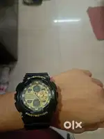 It's CASIO G- shock model  in black and golden colour for 8000