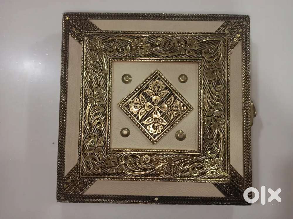 Cream RAJAWADI Dryfruit box with gold-colored decorative metalwork. 