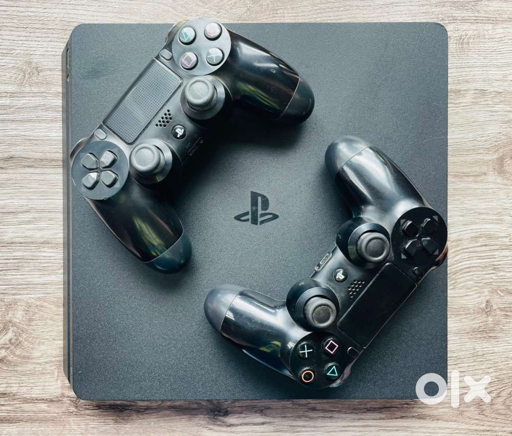 PS4 1 TB with 2 Game CDS & 2 Controllers