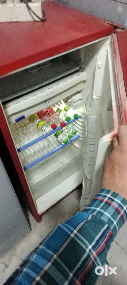 Red colour single door fridge proper working condition good cooling