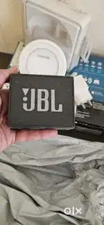Jbl small speaker, laptop  charger and wireless samsung charger