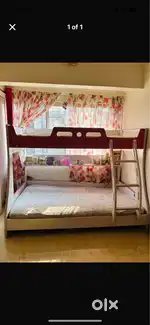 Bunk bed with mattresses in good condition perfect for small spaces